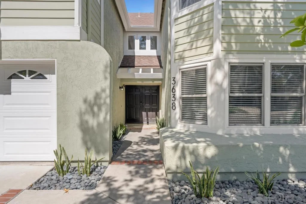 3638 Lorimer Lane Encinitas, CA 92024 - Photo 6 of 72 a front view of a house with a yard
