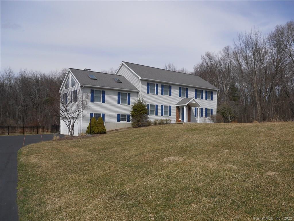 96 Gillotti Road New Fairfield, CT 06812 - Photo 1 of 1 a front view of a house with a yard