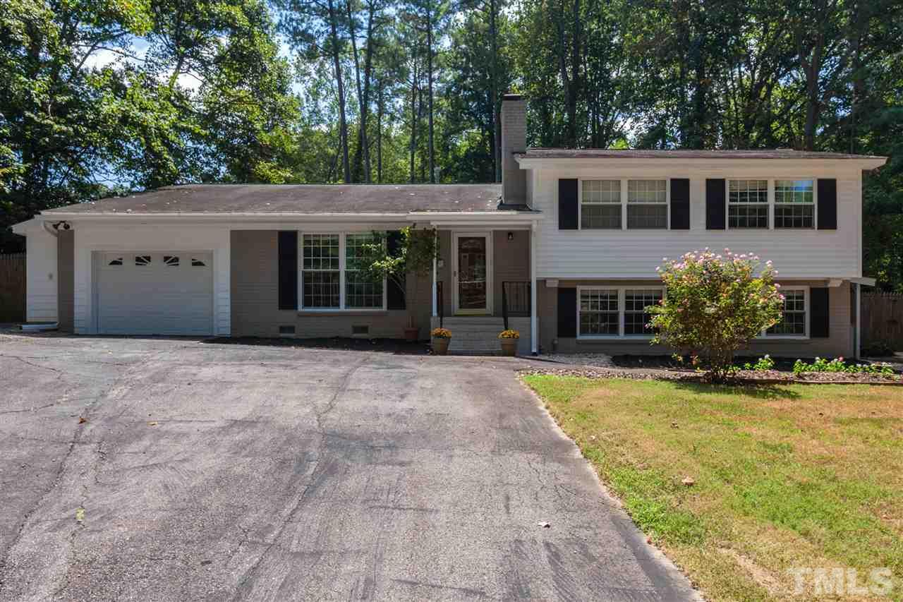 6609 King Lawrence Road Raleigh, NC 27607 - Photo 2 of 25 a view of a house with a yard and potted plants