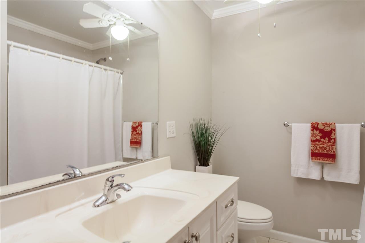 6609 King Lawrence Road Raleigh, NC 27607 - Photo 14 of 25 a bathroom with a sink vanity mirror and toilet