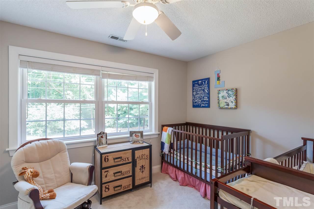 6609 King Lawrence Road Raleigh, NC 27607 - Photo 15 of 25 a bedroom with furniture and a window