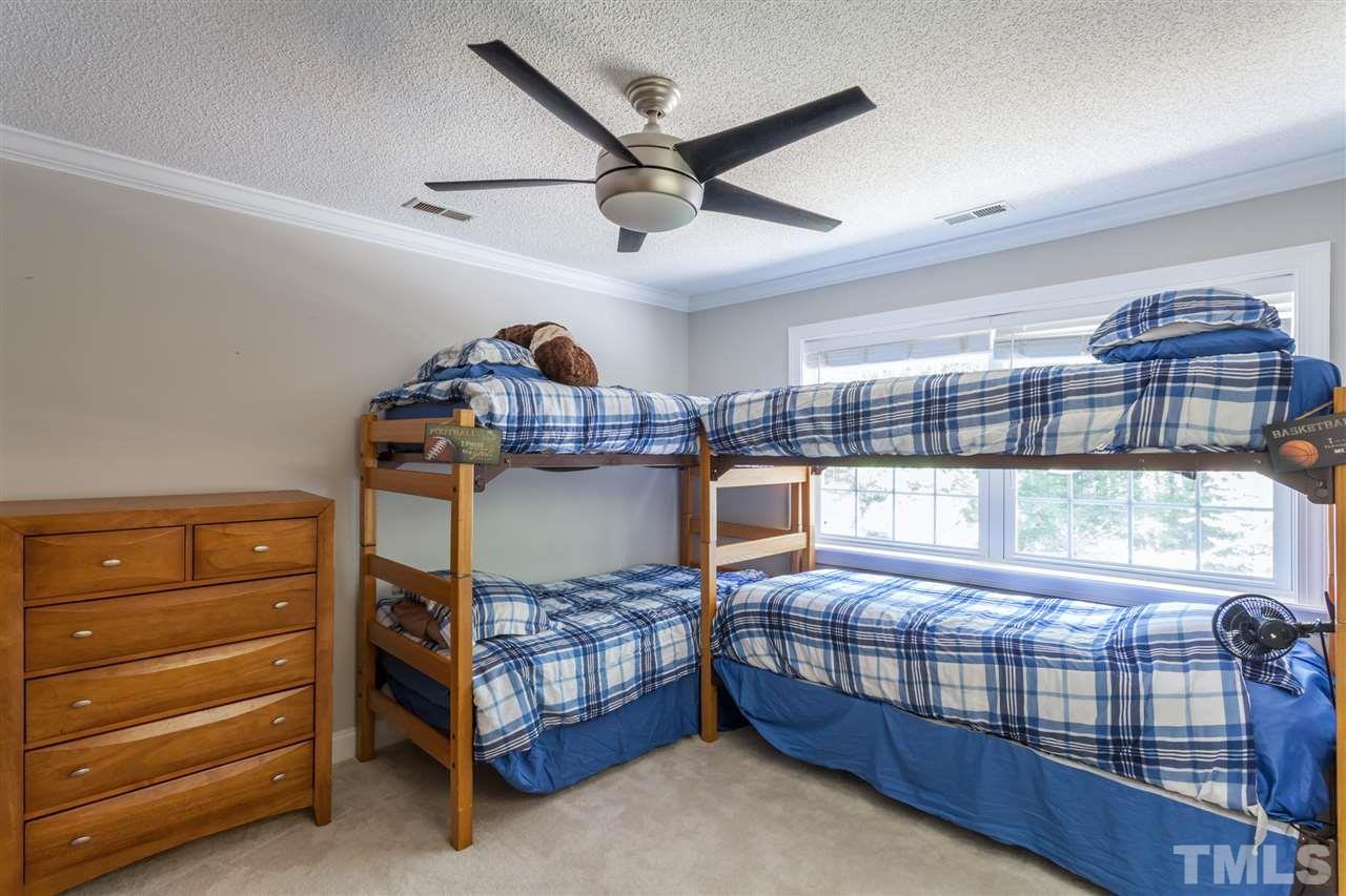 6609 King Lawrence Road Raleigh, NC 27607 - Photo 16 of 25 a bedroom with a bed and window