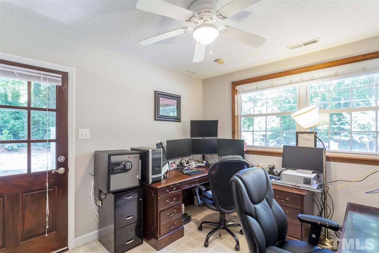 6609 King Lawrence Road Raleigh, NC 27607 - Photo 18 of 25 a view of a workspace with furniture and a window