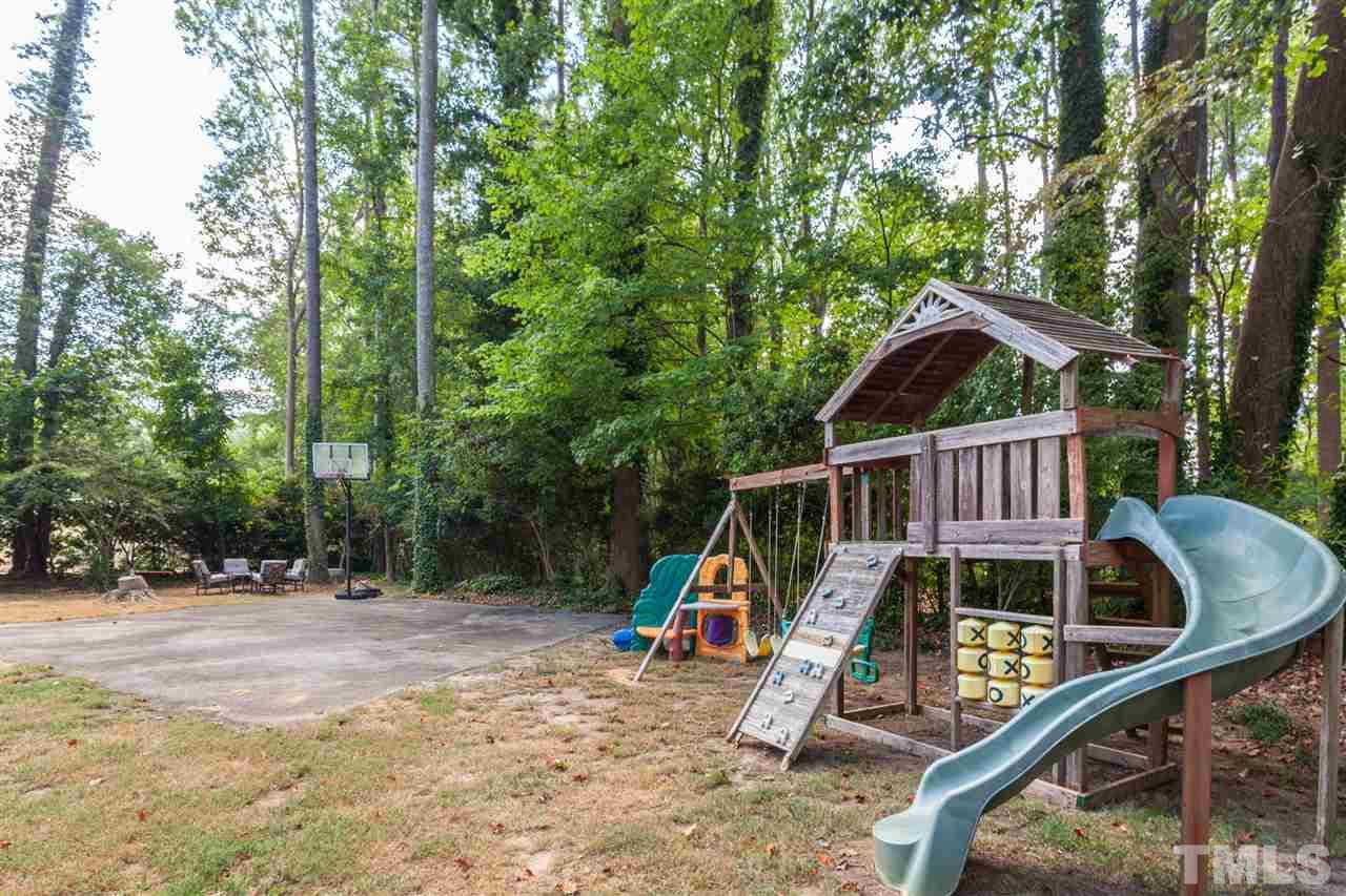 6609 King Lawrence Road Raleigh, NC 27607 - Photo 25 of 25 a view of wooden house with a wooden deck