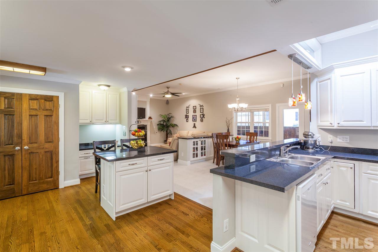6609 King Lawrence Road Raleigh, NC 27607 - Photo 5 of 25 a kitchen with stainless steel appliances granite countertop a sink stove and refrigerator