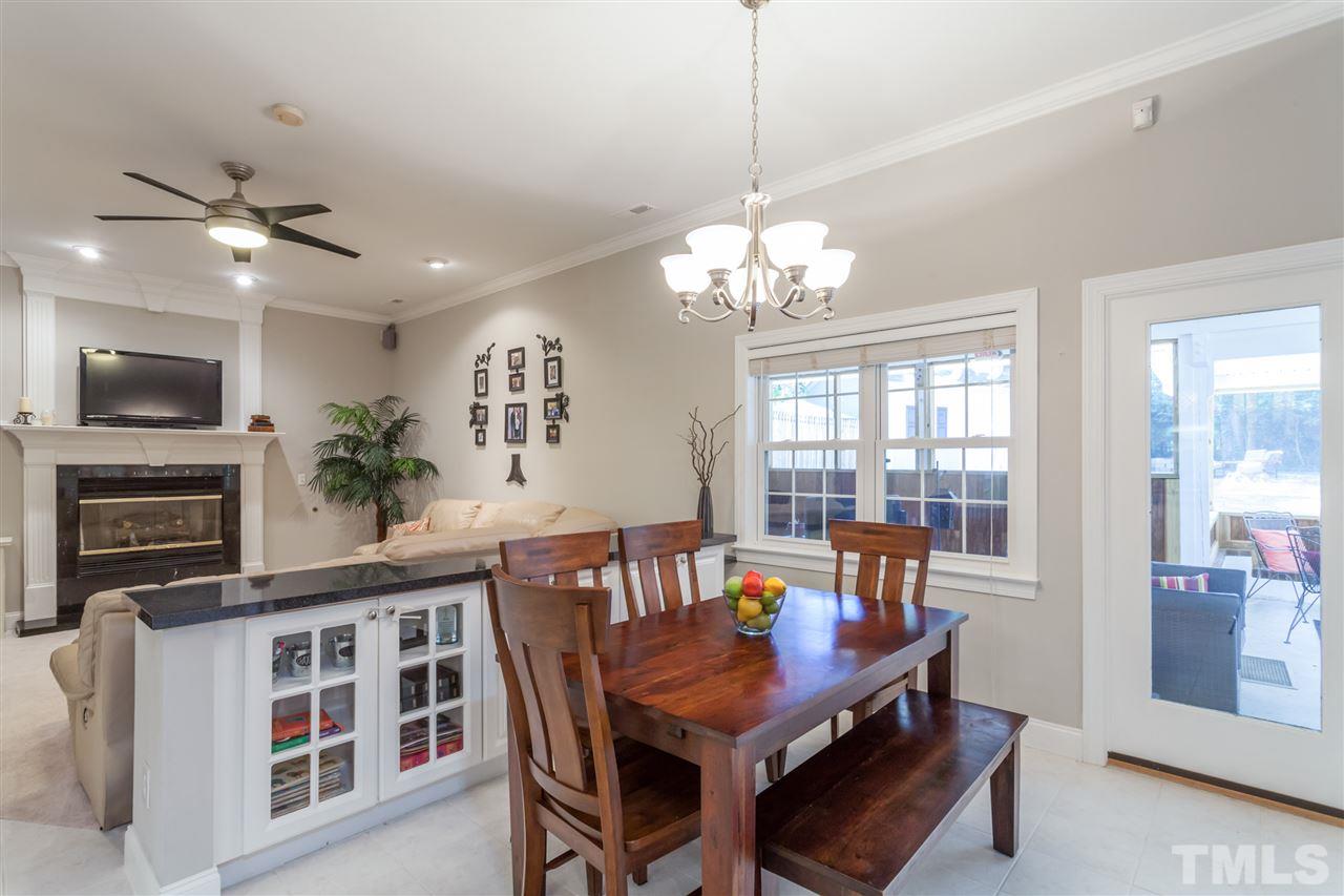 6609 King Lawrence Road Raleigh, NC 27607 - Photo 7 of 25 a view of a dining room with furniture window and wooden floor