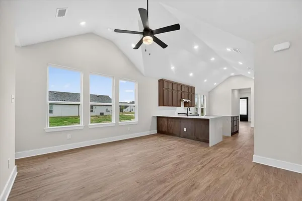 a living room with furniture window and wooden floor