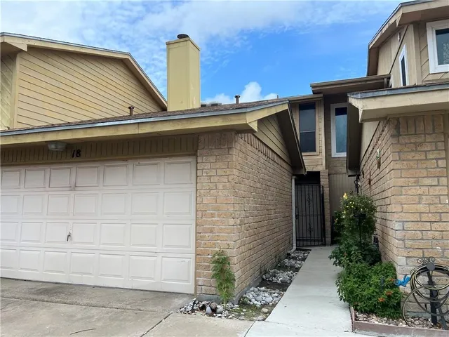 a side view of a house with garage