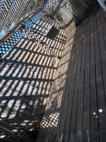 a view of balcony with wooden floor