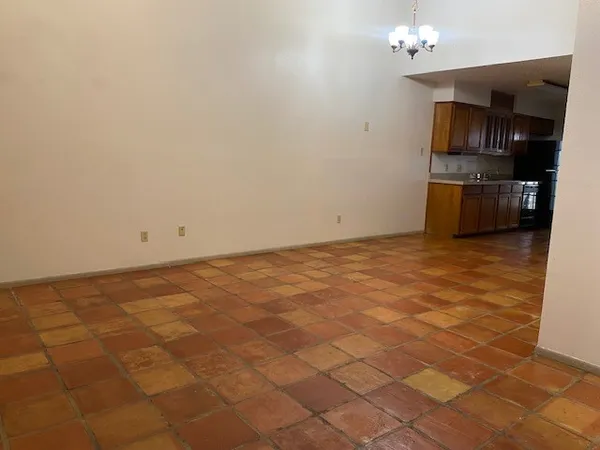 a view of a kitchen with microwave and cabinets