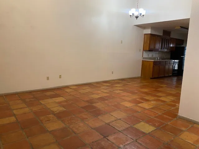 a view of a kitchen with microwave and cabinets
