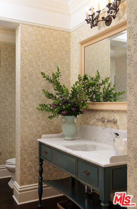2041 Mandeville Canyon Road Los Angeles, CA 90049 - Photo 38 of 46 a bathroom with a sink and mirror