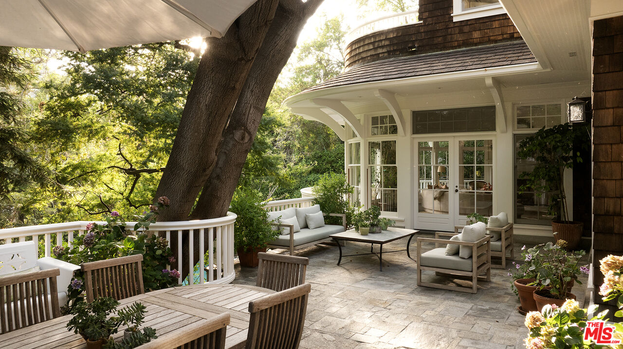 2041 Mandeville Canyon Road Los Angeles, CA 90049 - Photo 8 of 46 a view of a patio on the deck