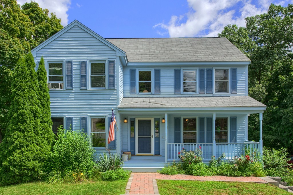 109 North Road Chelmsford, MA 01824 - Photo 1 of 30 a front view of a house with garden and porch