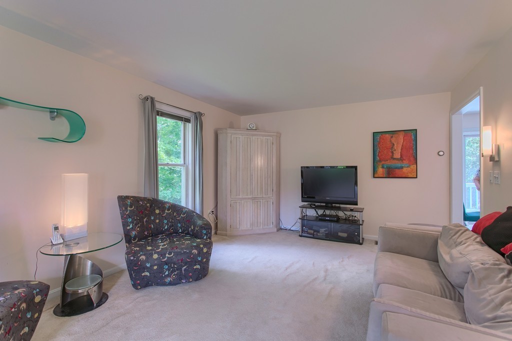 109 North Road Chelmsford, MA 01824 - Photo 13 of 30 a living room with furniture and a flat screen tv