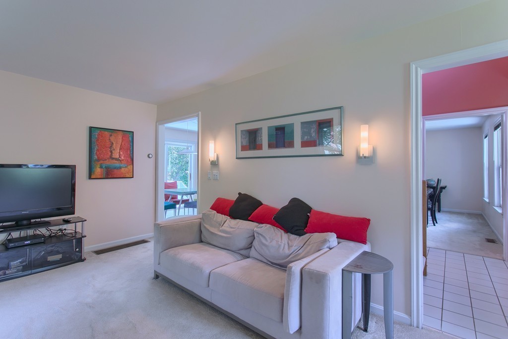 109 North Road Chelmsford, MA 01824 - Photo 14 of 30 a living room with furniture and a flat screen tv