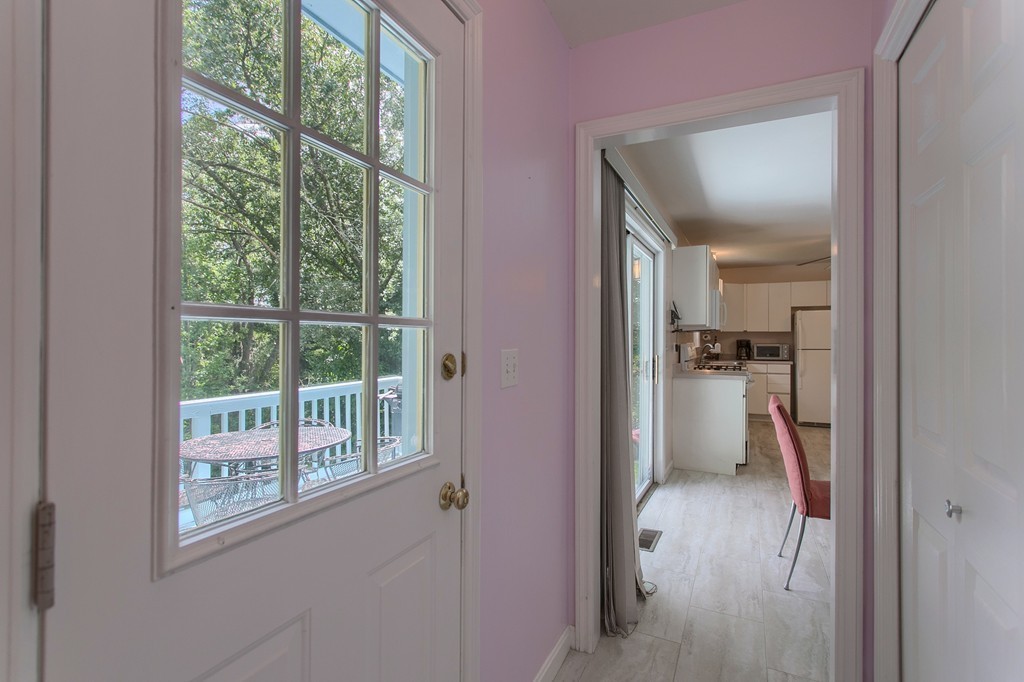 109 North Road Chelmsford, MA 01824 - Photo 17 of 30 a view of a hallway with a livingroom and a window