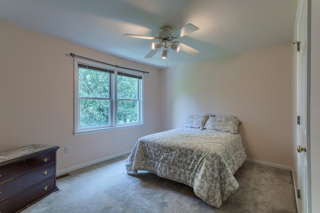 109 North Road Chelmsford, MA 01824 - Photo 23 of 30 a bedroom with a bed and window
