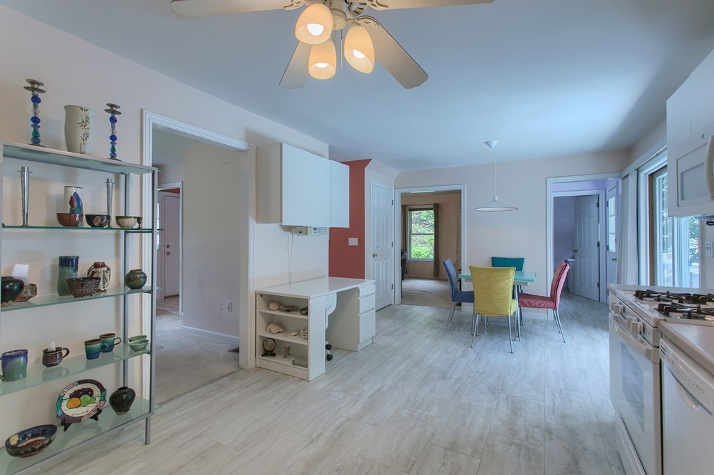 109 North Road Chelmsford, MA 01824 - Photo 4 of 30 a view of a dining room with furniture and a wooden floor