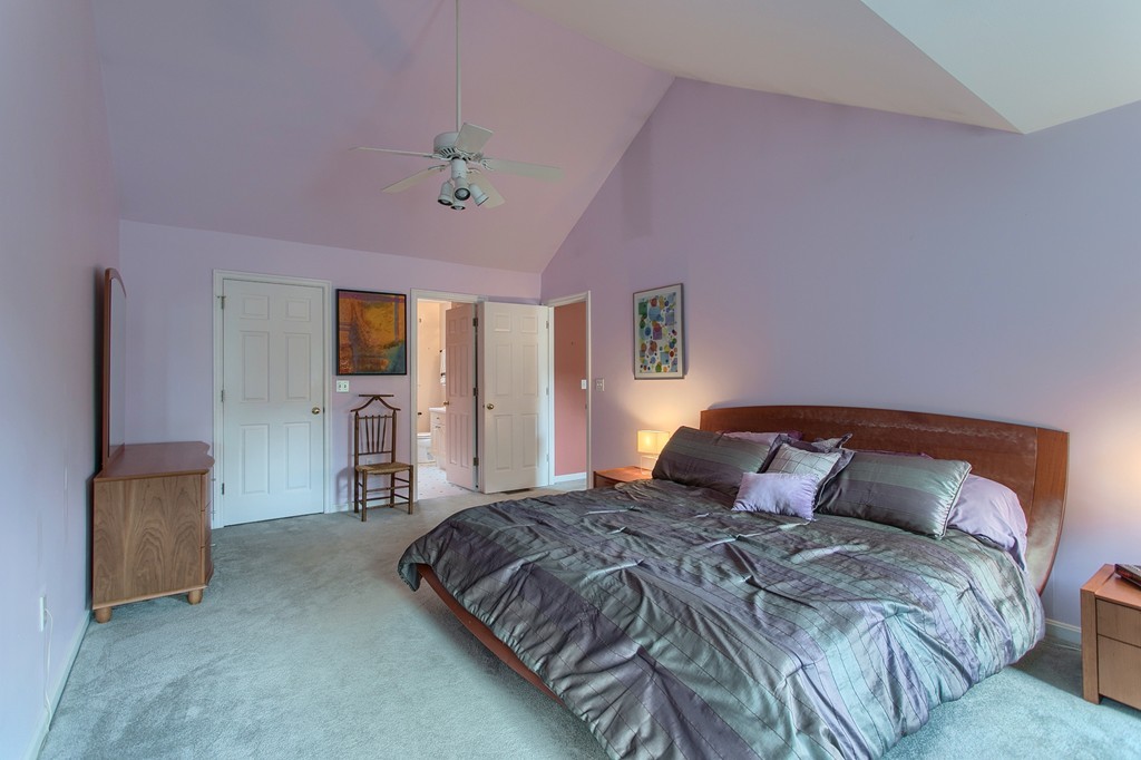 109 North Road Chelmsford, MA 01824 - Photo 7 of 30 a bedroom with a bed and a flat tv screen on dresser
