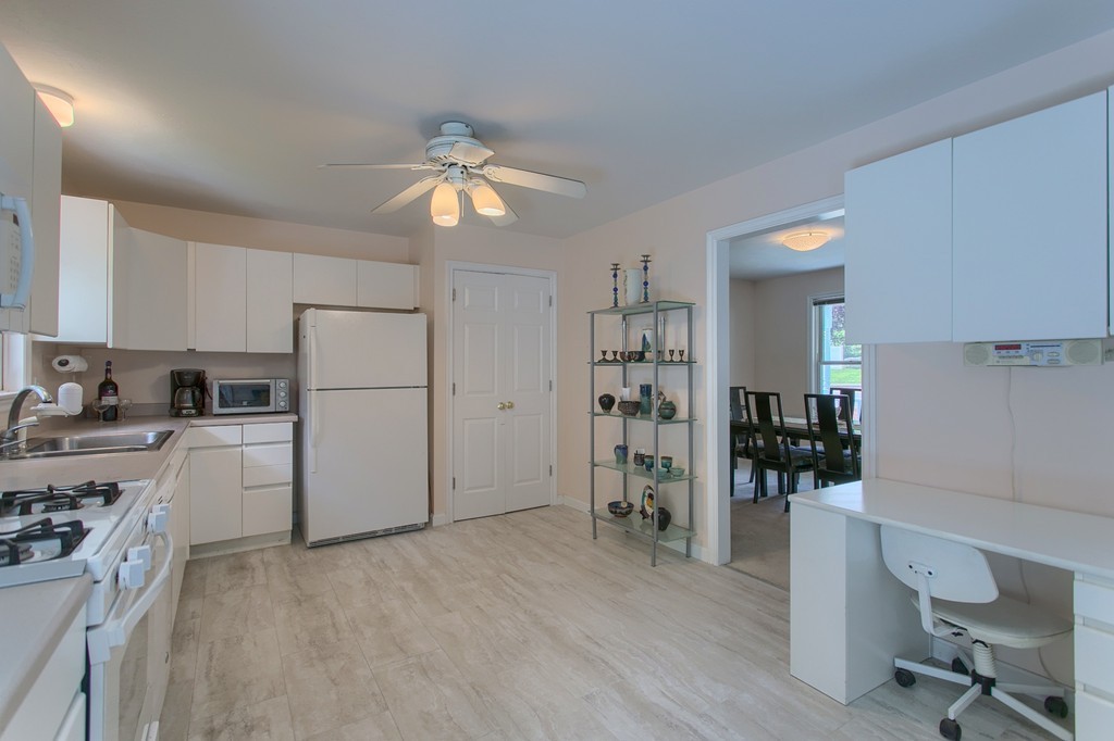 109 North Road Chelmsford, MA 01824 - Photo 10 of 30 a kitchen with refrigerator and cabinets