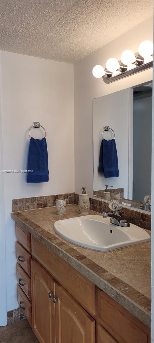 18031 Biscayne Boulevard, Unit PH03 Aventura, FL 33160 - Photo 13 of 21 a bathroom with a sink and a mirror
