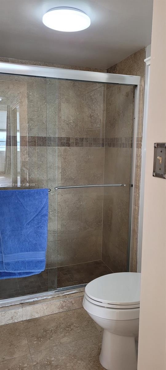 18031 Biscayne Boulevard, Unit PH03 Aventura, FL 33160 - Photo 14 of 21 a bathroom with a toilet and a shower