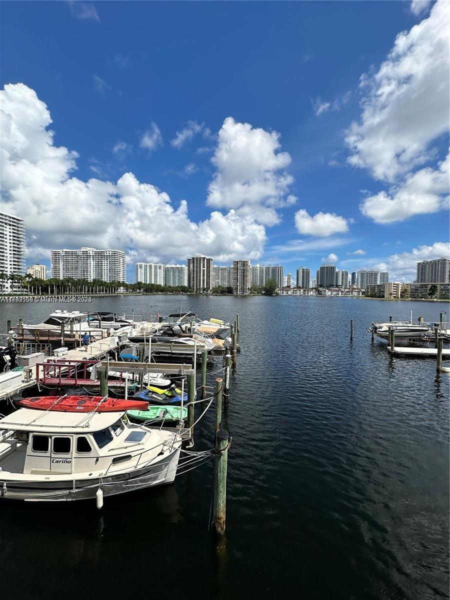18031 Biscayne Boulevard, Unit PH03 Aventura, FL 33160 - Photo 5 of 21 a view of water with boats and trees in the background