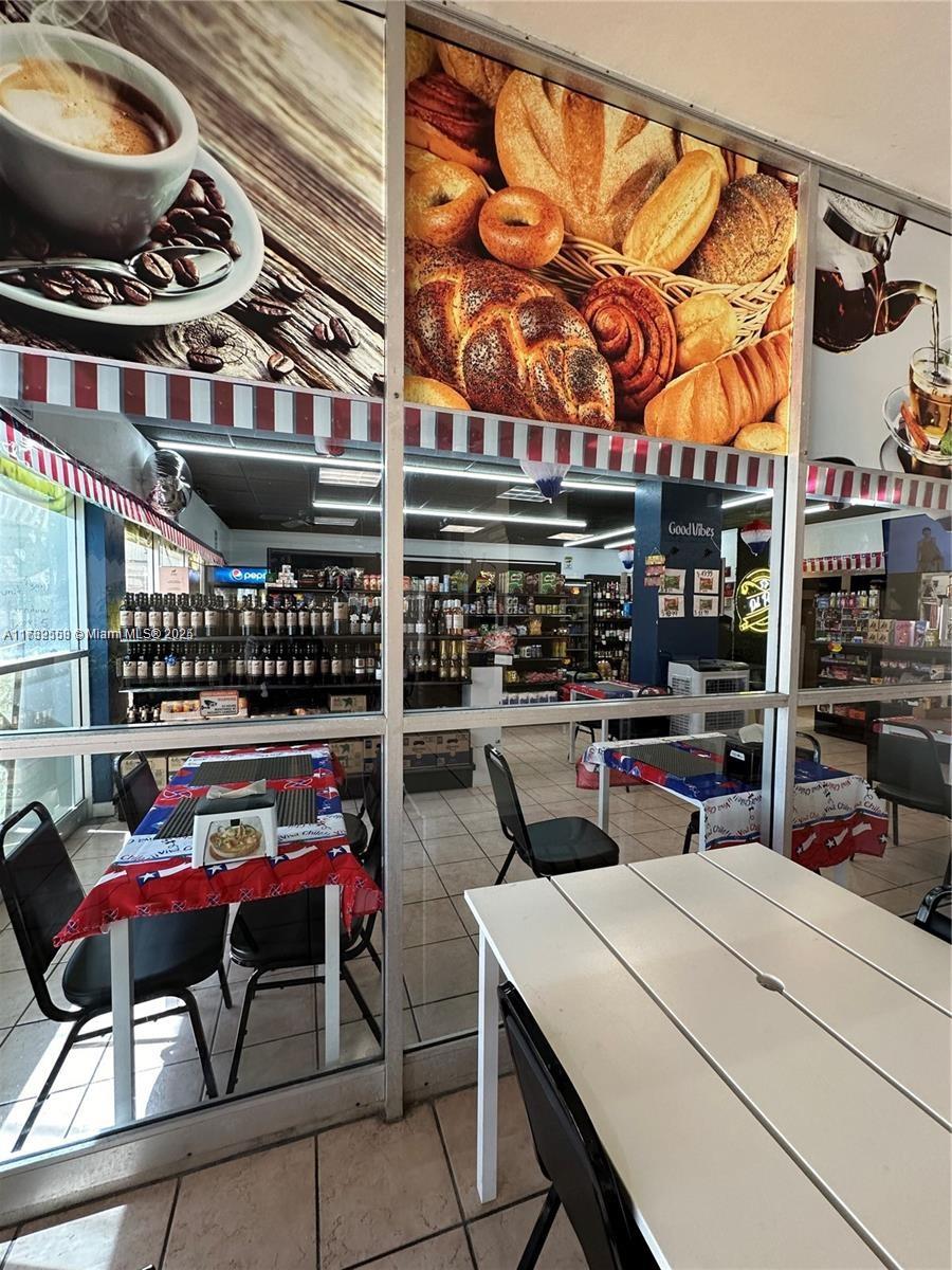 18031 Biscayne Boulevard, Unit PH03 Aventura, FL 33160 - Photo 6 of 21 a view of a chairs and table in a room