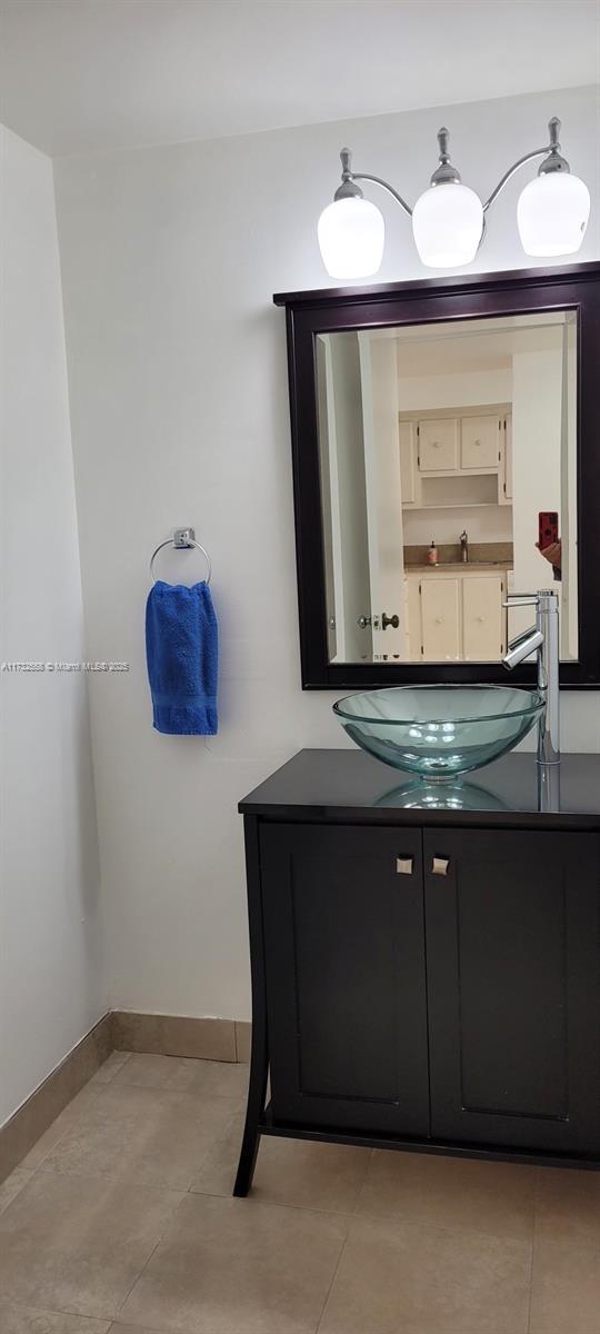 18031 Biscayne Boulevard, Unit PH03 Aventura, FL 33160 - Photo 9 of 21 a bathroom with a sink and a mirror