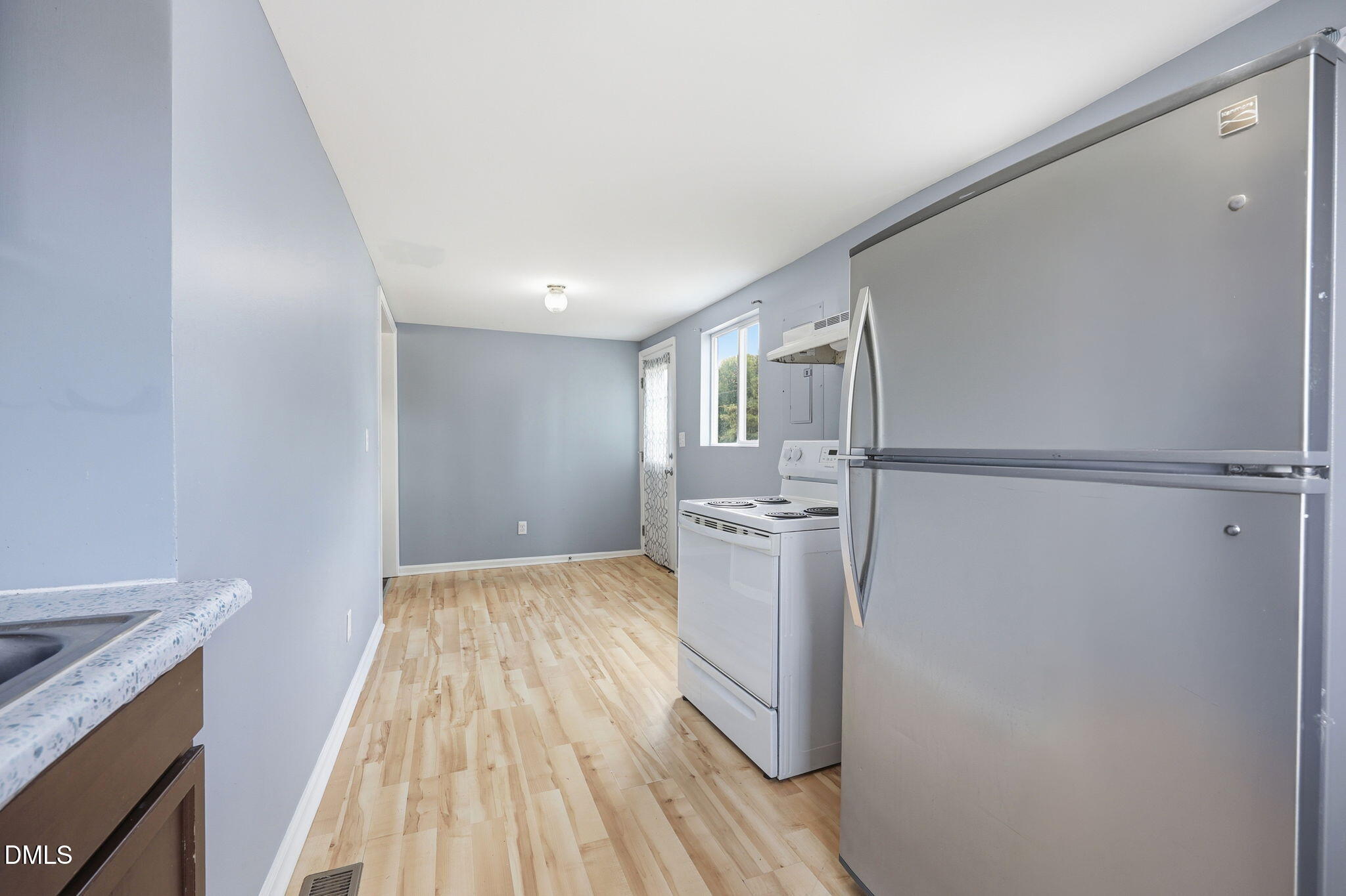 1758 Barber Mill Road Clayton, NC 27520 - Photo 12 of 41 a view of a kitchen with wooden floor