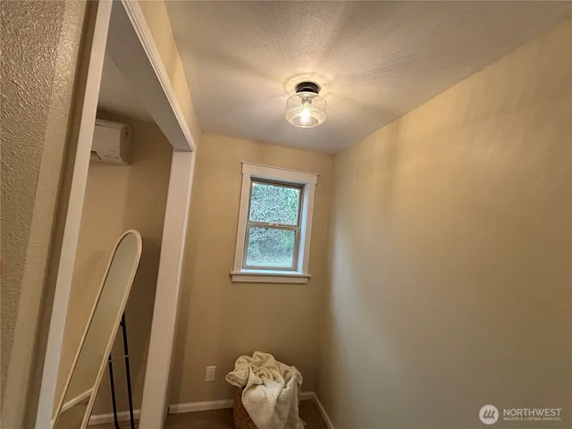 a bathroom with a glass door shower and a sink