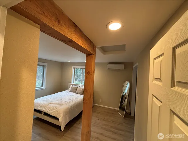 a view of front door with wooden floor