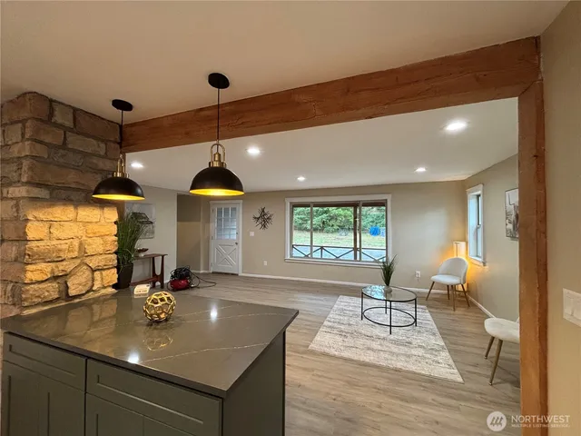a view of a kitchen with a sink and cabinets