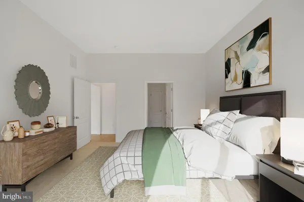a bedroom with a bed and dresser