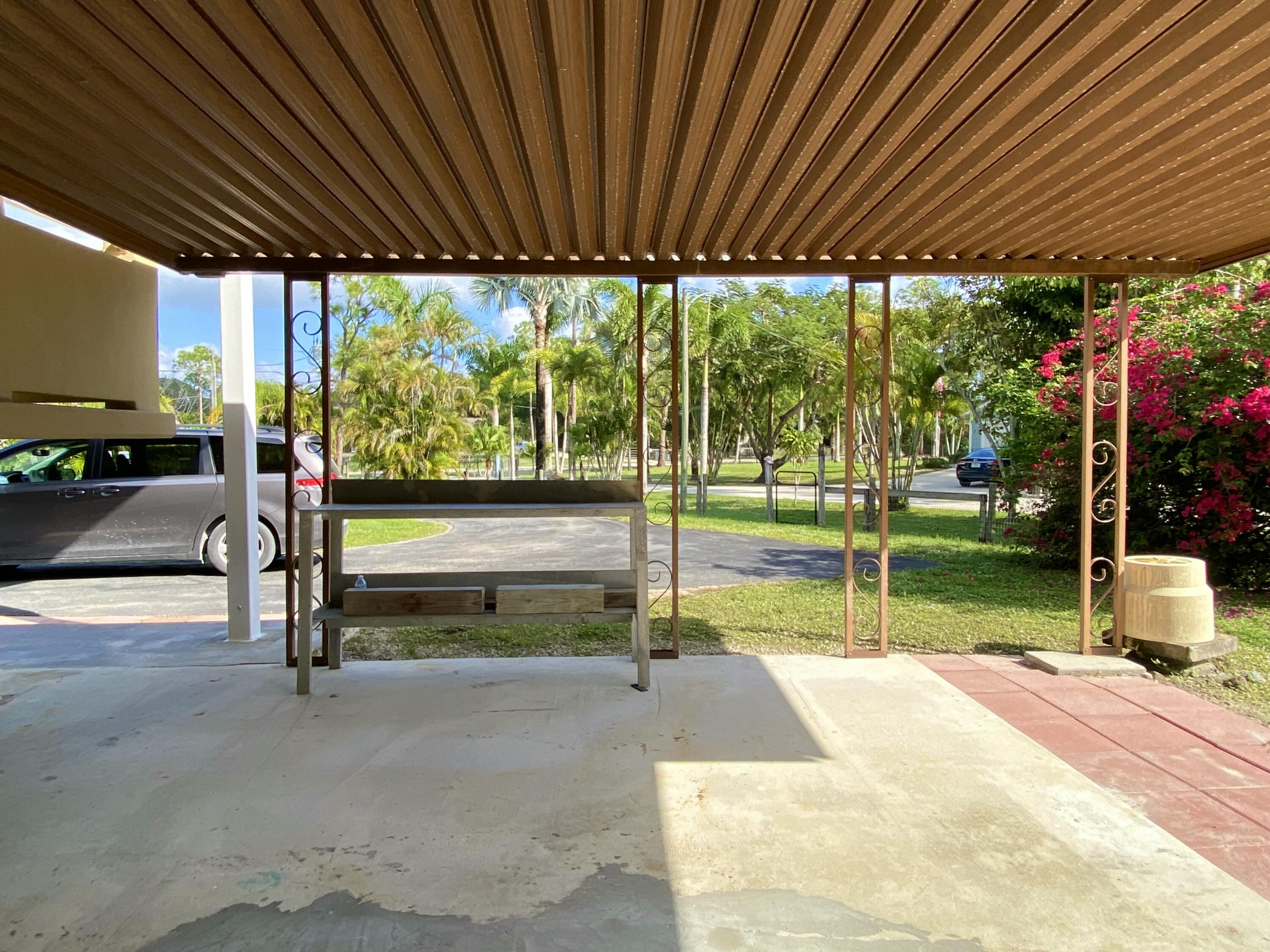 13640 153rd Road North Jupiter, FL 33478 - Photo 54 of 74 downstairs porch