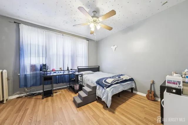 a bedroom with a bed and a table