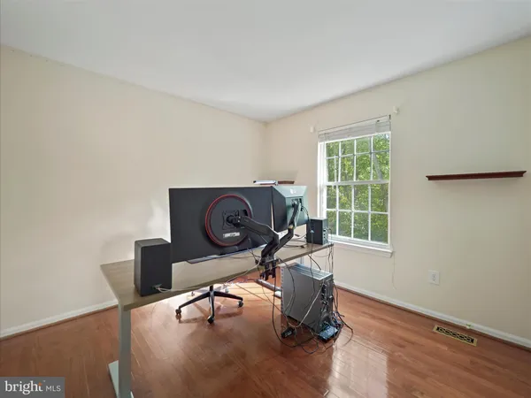 a workspace with furniture and wooden floor