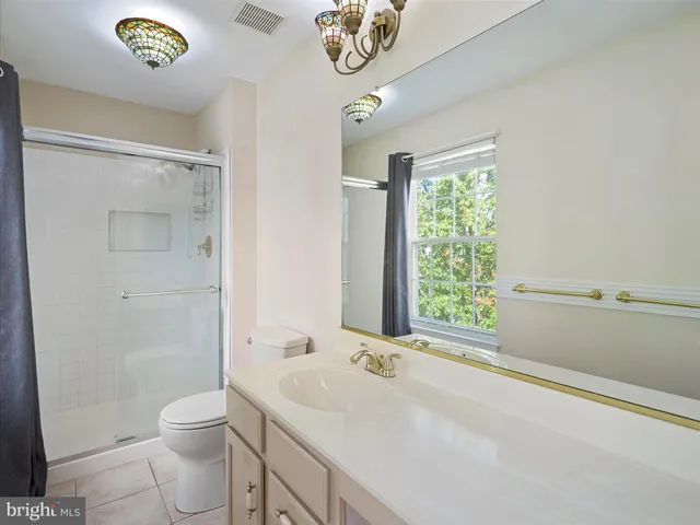 a bed room with a bed and a television