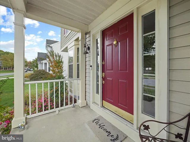 a view of a bench in backyard of the house