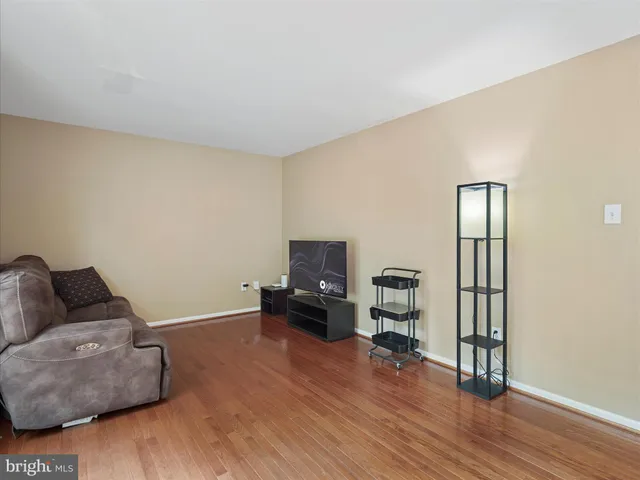a kitchen with granite countertop white cabinets and appliances