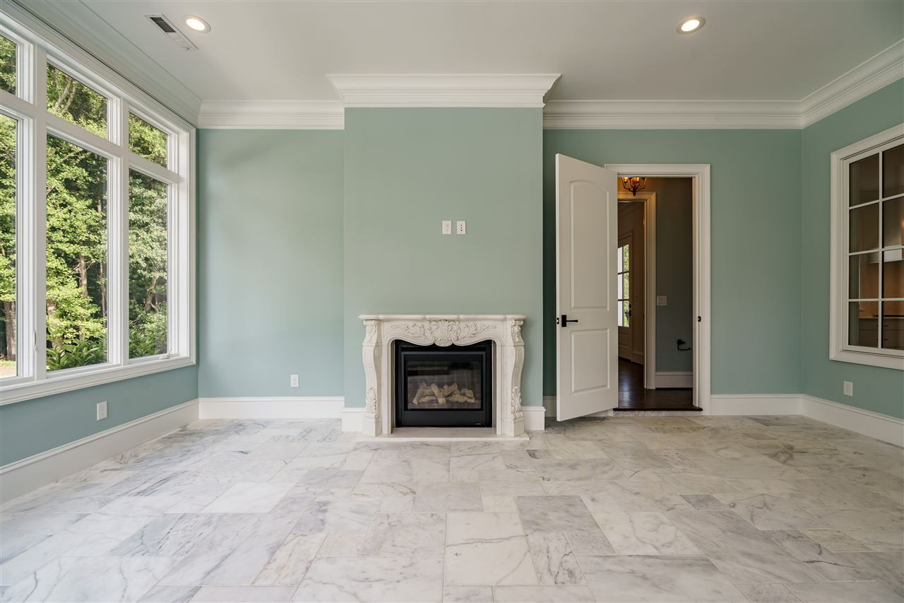 6505 Century Oak Court Raleigh, NC 27613 - Photo 9 of 30 Relaxing Sunroom with Fireplace