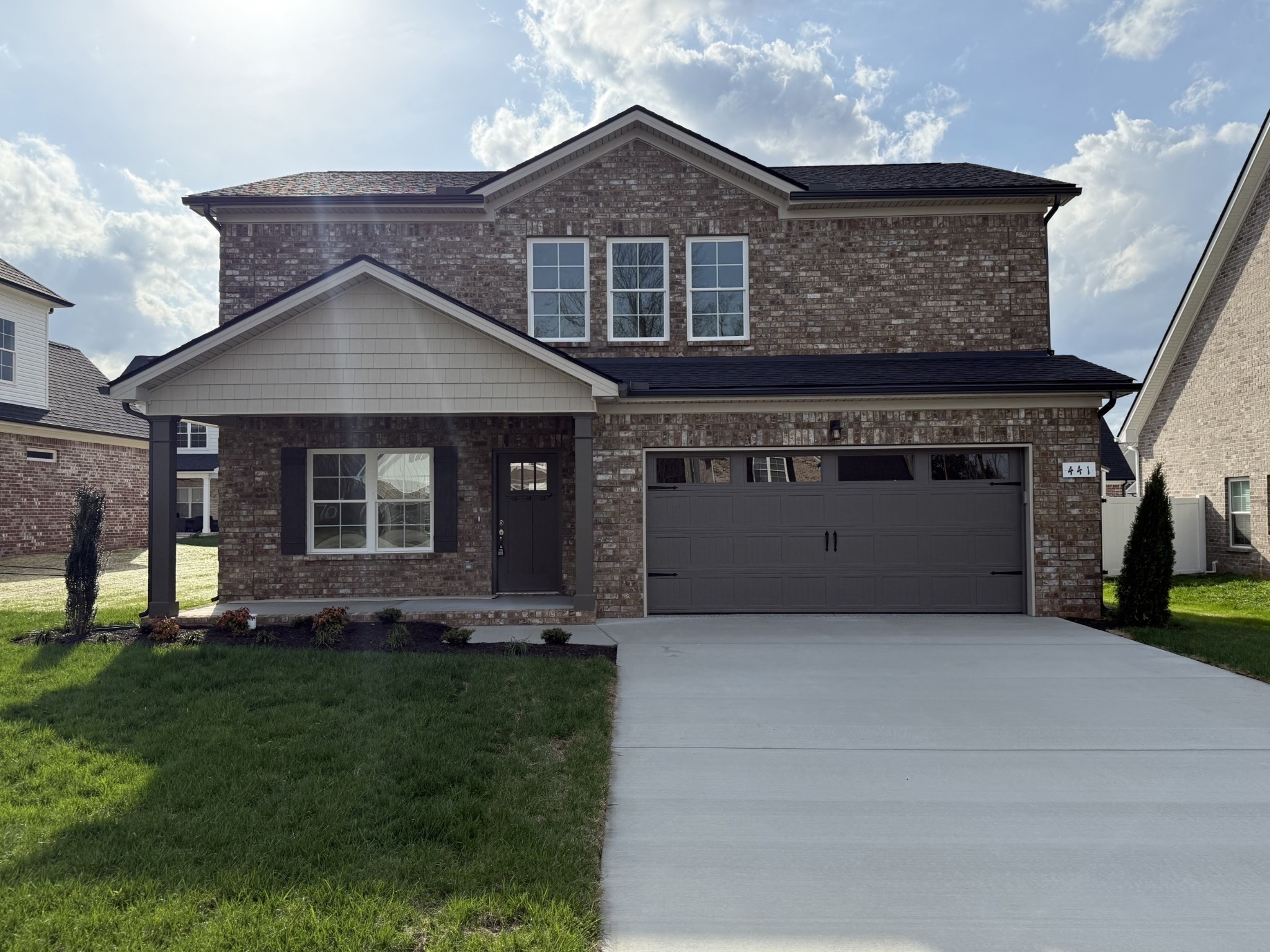 6 Laurel View Street Manchester, TN 37355 - Photo 3 of 11 a front view of a house with a yard and garage