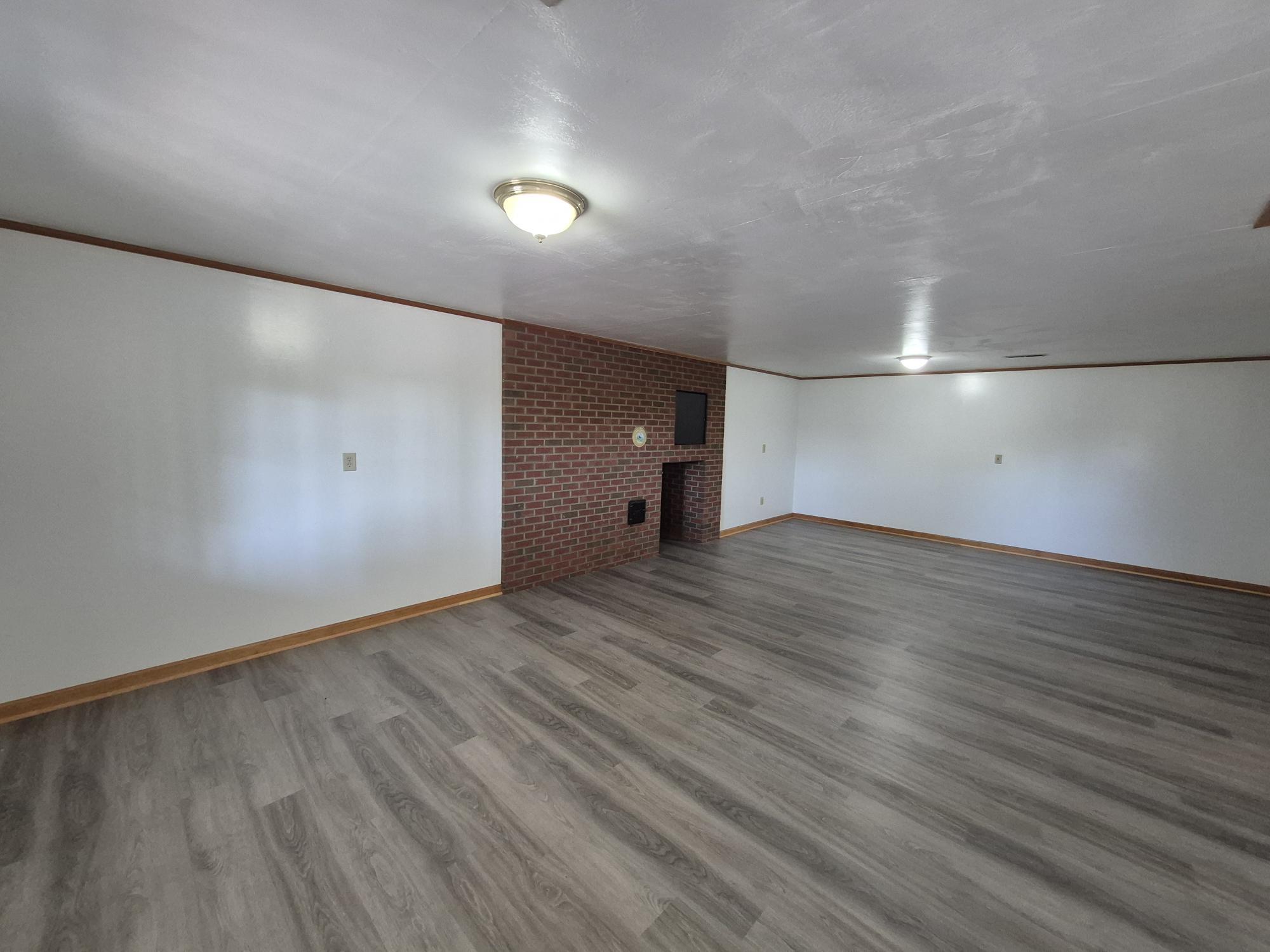 10048 Moneta Road Bedford, VA 24523 - Photo 14 of 51 a view of empty room with wooden floor