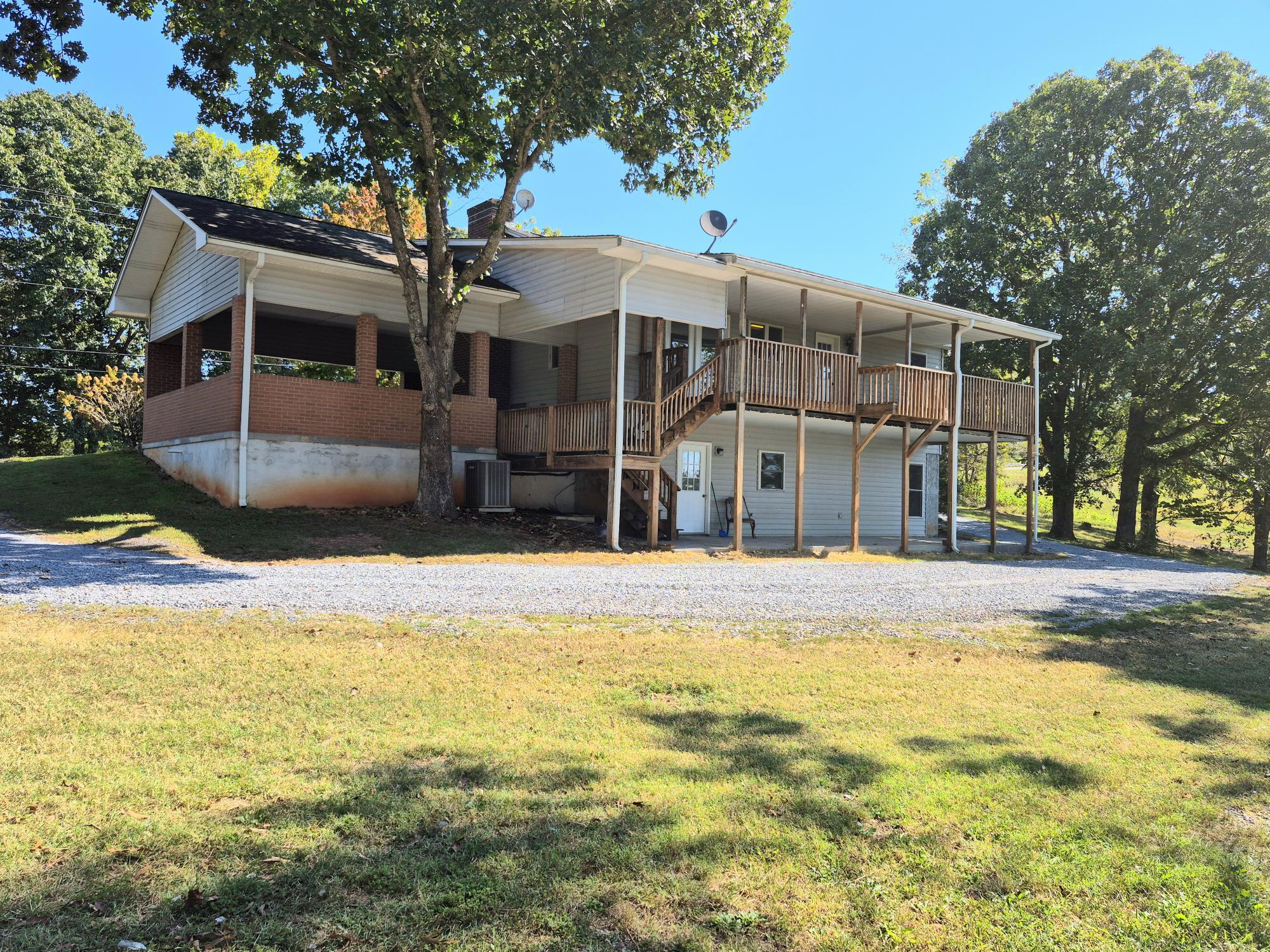 10048 Moneta Road Bedford, VA 24523 - Photo 2 of 51 a view of a house with a swimming pool and a patio