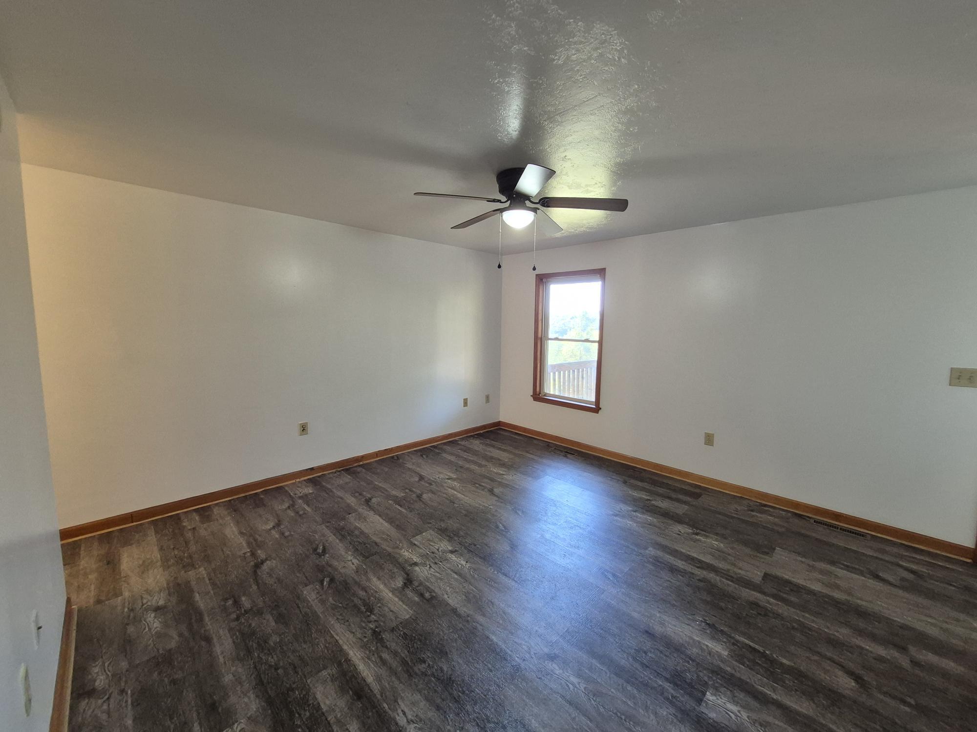 10048 Moneta Road Bedford, VA 24523 - Photo 21 of 51 wooden floor in an empty room with a window
