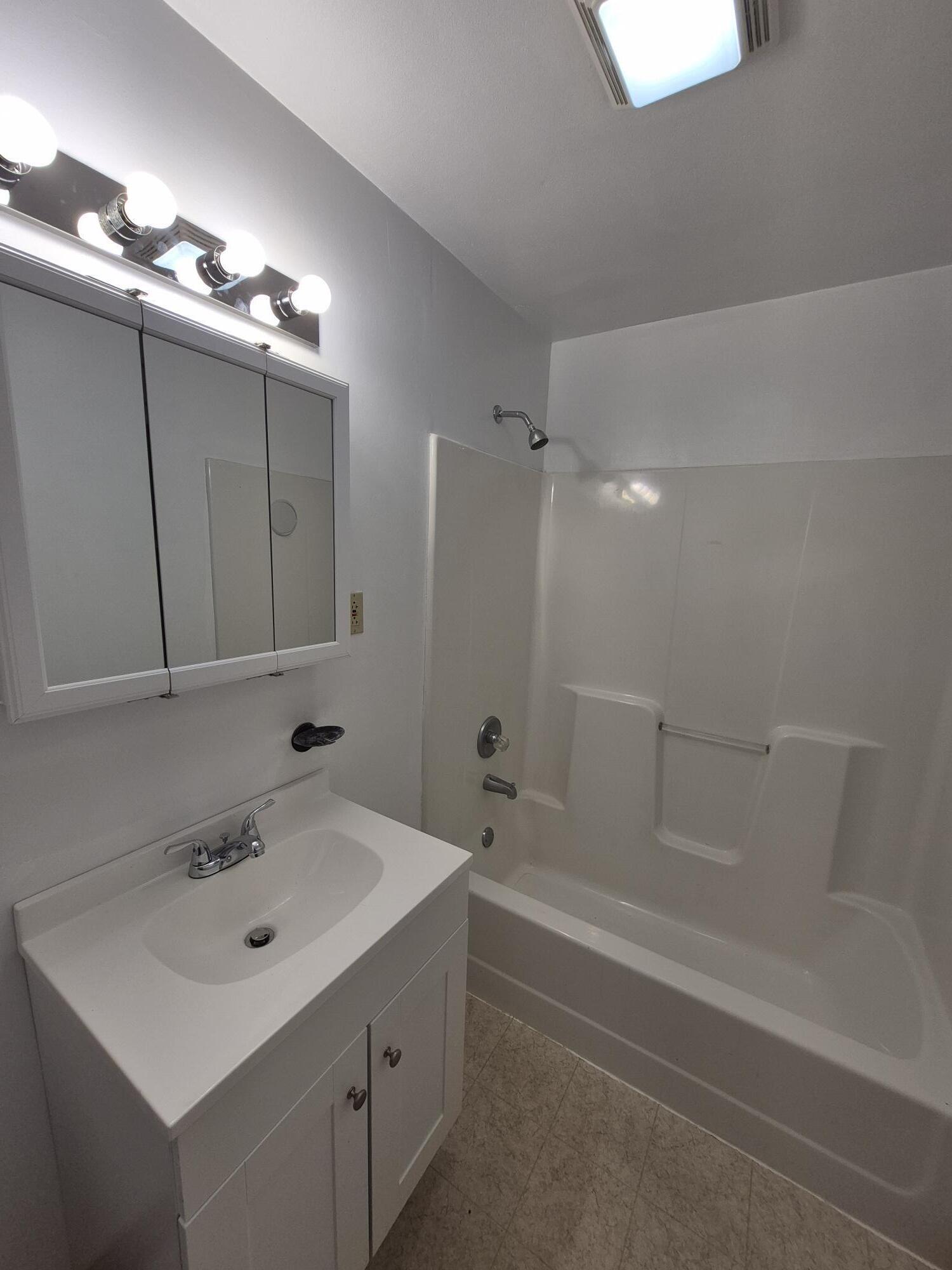 10048 Moneta Road Bedford, VA 24523 - Photo 33 of 51 a bathroom with a sink a shower and a mirror