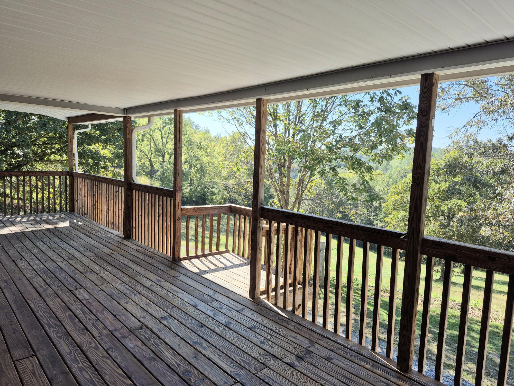 10048 Moneta Road Bedford, VA 24523 - Photo 36 of 51 a view of a wooden balcony with outdoor space
