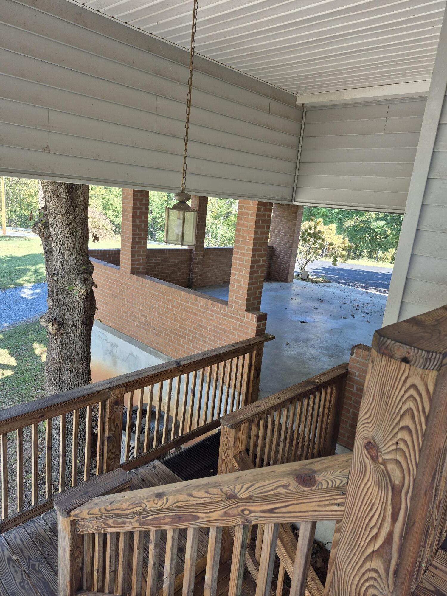 10048 Moneta Road Bedford, VA 24523 - Photo 37 of 51 a view of a wooden chairs on the roof deck