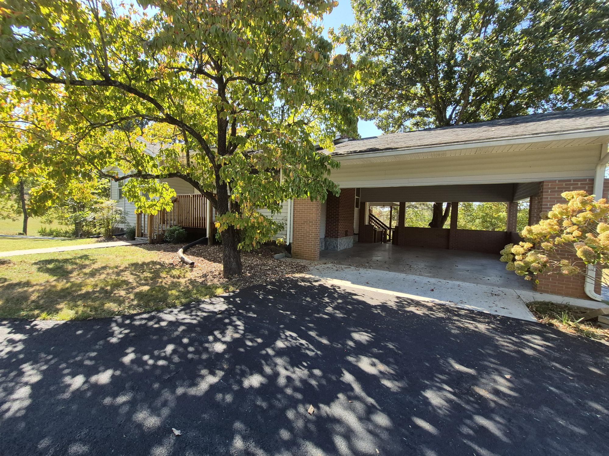 10048 Moneta Road Bedford, VA 24523 - Photo 4 of 51 a view of a yard with plants and trees